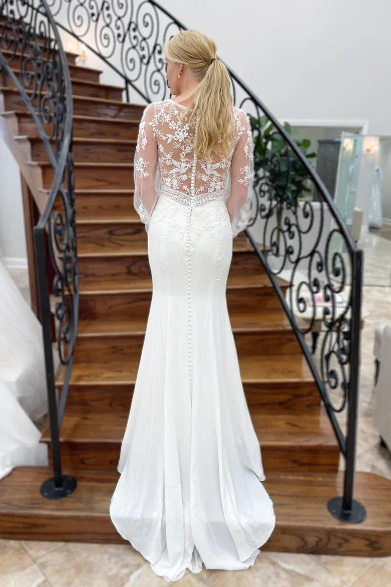 Vestido de novia largo de sirena con escote en V profundo y mangas ilusión con apliques